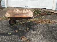 Old rusty wheelbarrow for gardening