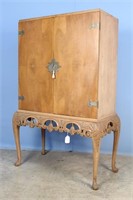A Blonde Mahogany Liquor Cabinet w/ Carved Apron
