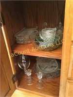 2 shelves assorted glassware platters candle
