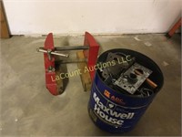 small clamp and tin of garage trinkets
