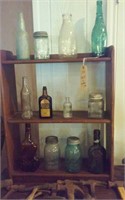Wooden shelf with old bottles & jars