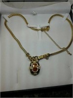 Interesting gold coloured necklace. Sugg ret $100