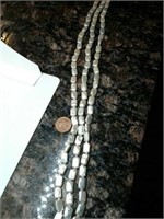 3 strands of fresh water pearls. 16" each