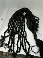 12 strands of onyx beads. Each strand 15" long