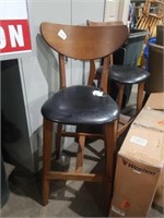 Wood and looks like leather seat bar stool