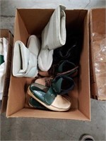 Box of Prada shoes and boots