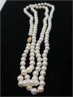Pearl necklace with 14 Kt gold clasp/ 36" long