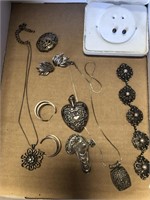 Box of antique silver jewelry