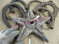 lot: old cast iron star & 8 large horse shoes