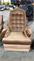 Latte coloured swivel/rocker chair. 35x27x26