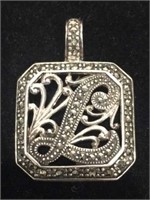 Sterling pendant with “L” in center