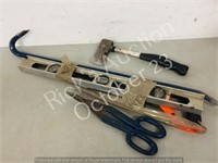 small bundle of tools -  Hatchet , level , saw
