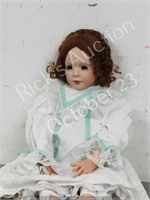 29" tall Porcelain doll ( red hair-green dress)