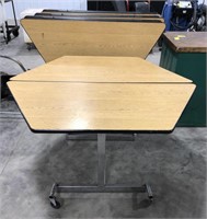 Folding and rolling tables.   50.5”