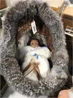 Indian doll in basket