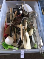 Tub with assorted kitchen utensils
