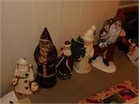 Five ceramic Father Christmas Santa figurines