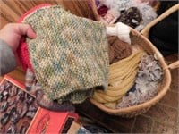 Woven basket with contents: hand crocheted hats