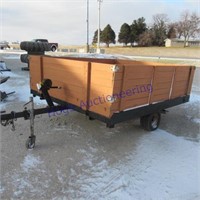 Snowmobile trailer, tilt bed