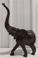 Wooden carved elephant measures approximately 14"