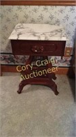 Small mahogany table with marble top