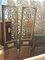 2 old doors with wrought iron windows