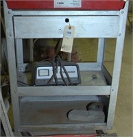 rolling metal stand with Schmacher 10 amp