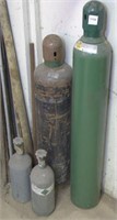 assorted oxy acetylene bottles, steel pipes and