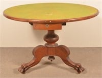 Oak Circular Pedestal Table with Carved Paw Feet.