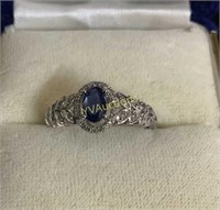 10CT WHITE GOLD OVAL CUT SAPPHIRE AND DIAMOND RING