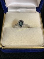 SILVER OVAL CUT BLUE TOPAZ AND DIAMOND RING