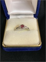 SILVER OVAL RUBY AND DIAMOND RING