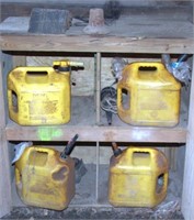 asstd. yellow fuel cans with various nozzles,