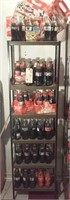 69 commemorative coca cola bottles + 9 carriers