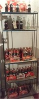 70 commemorative coca cola bottles + 12 carriers