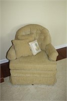 gold swivel chair w/pillows