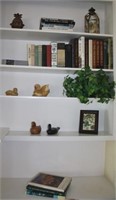 misc. books & decor on shelf in living room