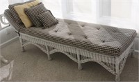 white wicker chaise with cushion & pillows