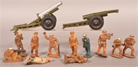 11 Vintage Rubber Toy Soldiers and Two Howitzers.