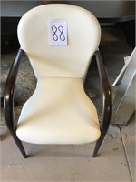 White leather chair with modern brown arm design