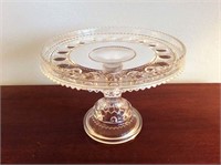 Clear glass cake stand, 9 1/2 inch diameter.