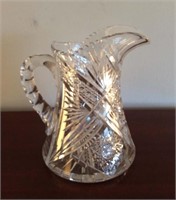 Cut glass pitcher,  9 inches tall, 7 inches