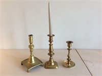 Three brass candlesticks, 1 has push-up.