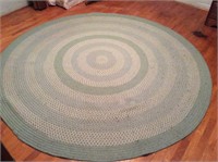 Round braided rug, pale green, 8 feet diameter.