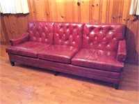 Red leather sofa, 3 cushions, tufted back,
