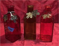set of three decorative bottles