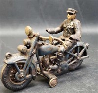 Vintage cast iron man on a motorcycle