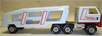 Plastic Tonka truck with metal trailer