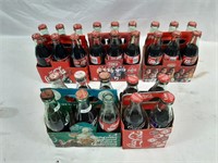 Four Coca-cola Six Packs And One Four Pack Of