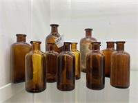 9 Assorted Early Brown Glass Medicine Bottles